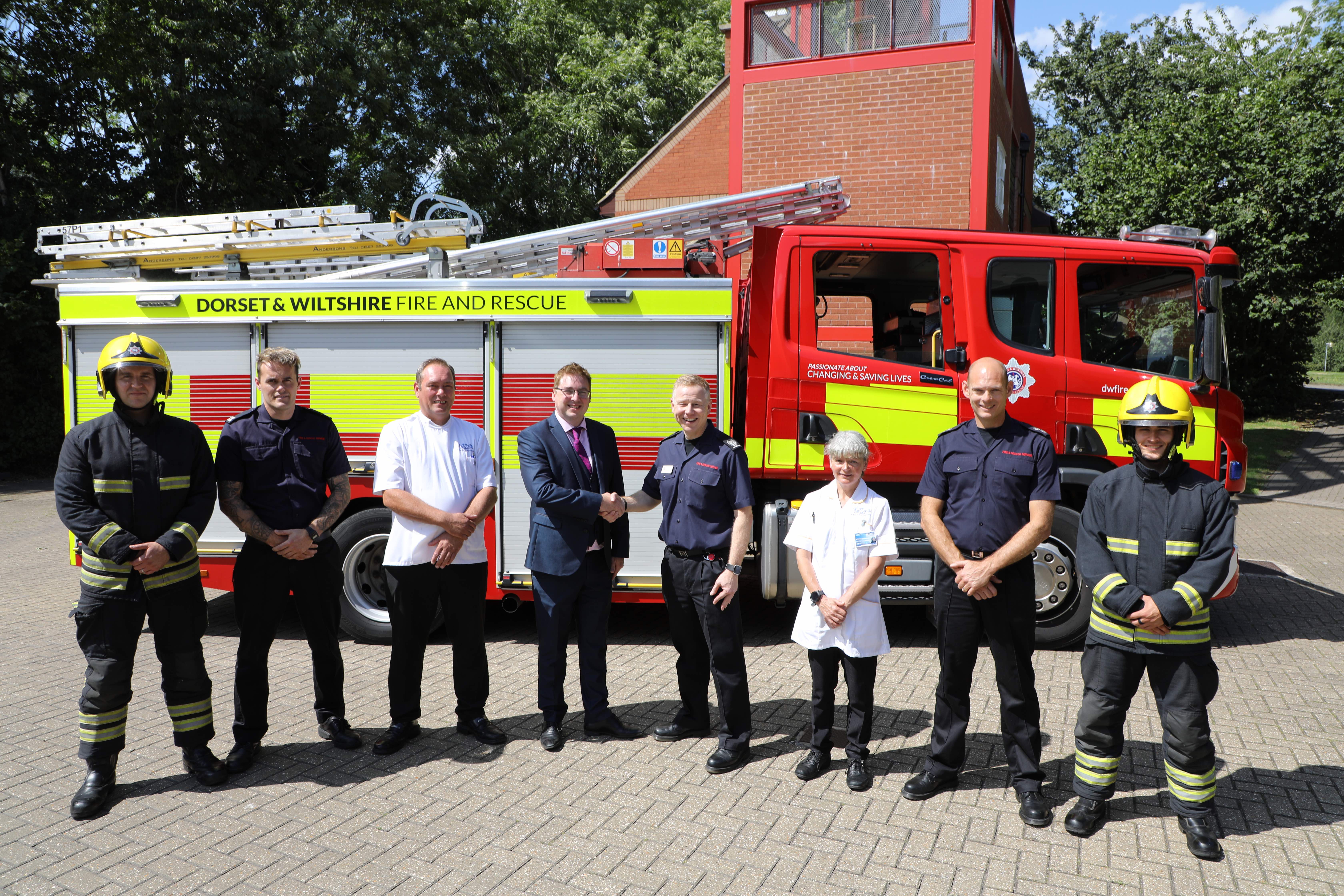Representatives of First City Nursing with Westlea firefighters