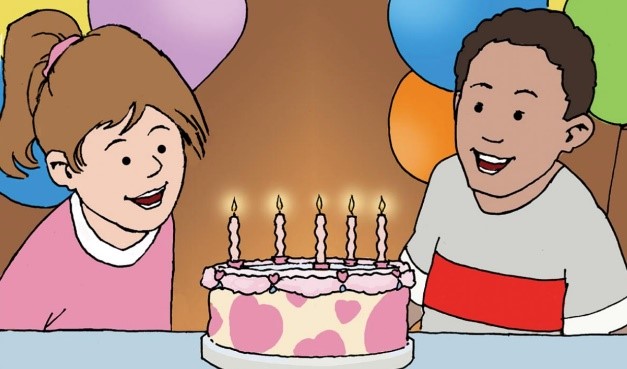 Two children blowing out candles on a birthday cake.