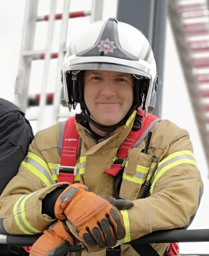 Picture of Guy Tadman in fire kit