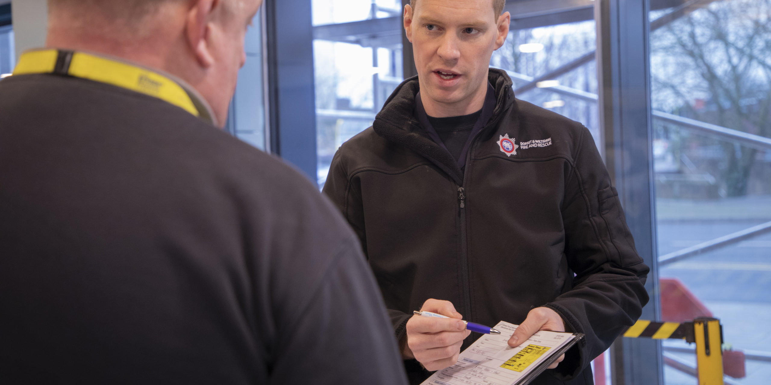 Member of Fire Safety Team talking to a business owner