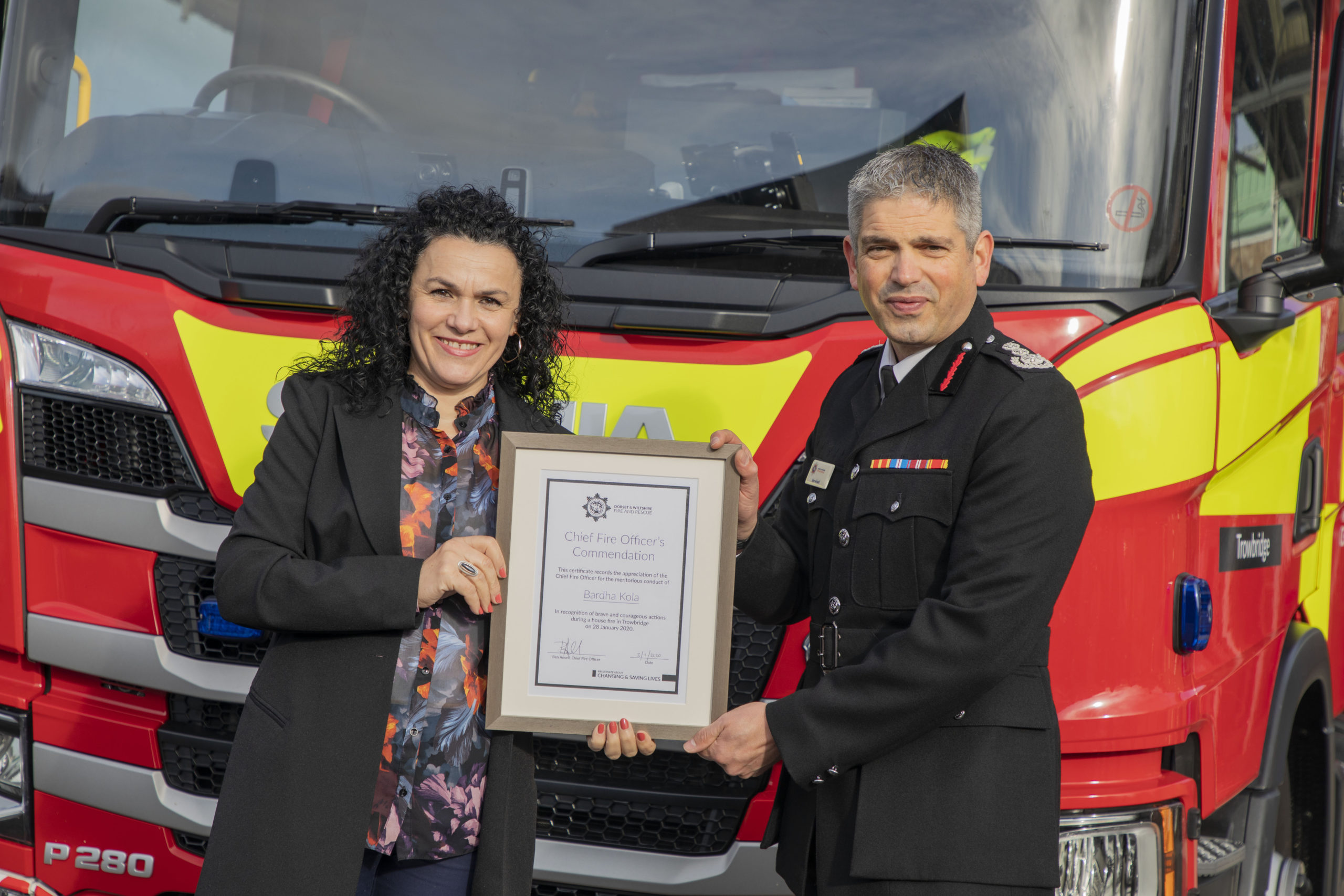 Chief fire officer presents commendation certificate